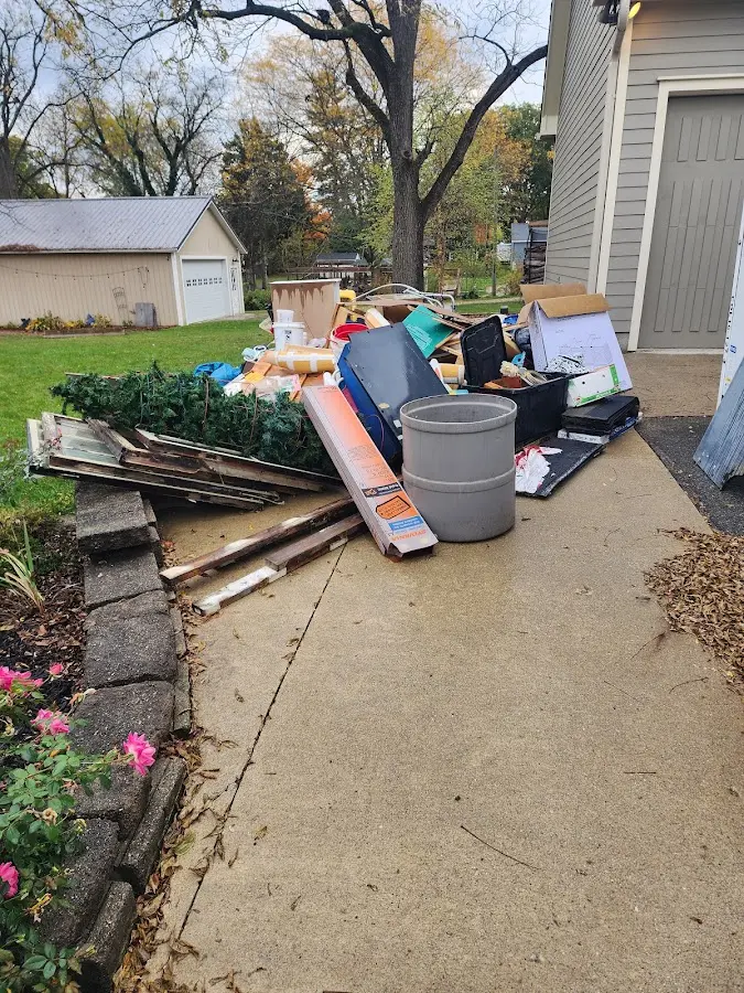 Dumpster being loaded with debris for Commercial Dumpster Rental in Lockport